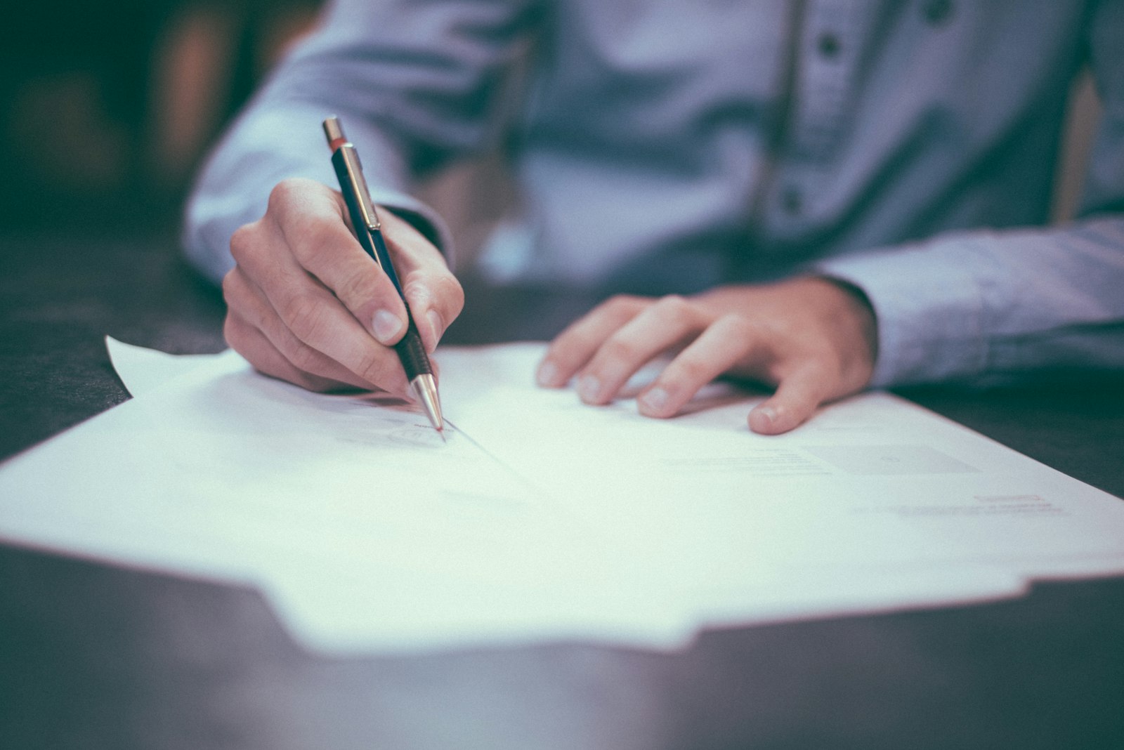Arizona home closing with escrow documents and keys on a table